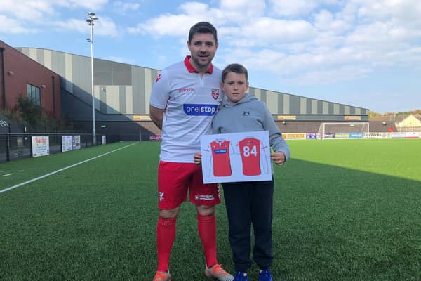 Boro player-coach and club captain Ryan Blott wears the new third shirt and competition winner Lennon Slaughter shows off the first-team kit he designed for the NPL Premier club