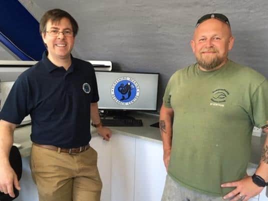 John Terschak, marine scientist, and Jamie Robertson, chief executive of the Holderness Fishing Industry Group, in the facility’s laboratory