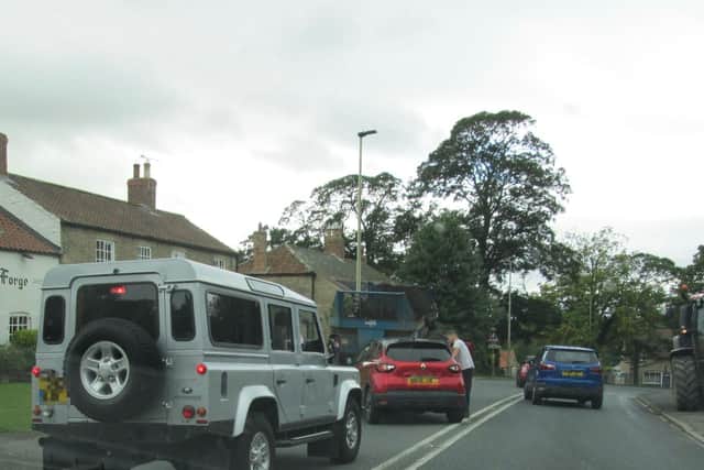 Two cars were damaged when the trailer detached from the tractor