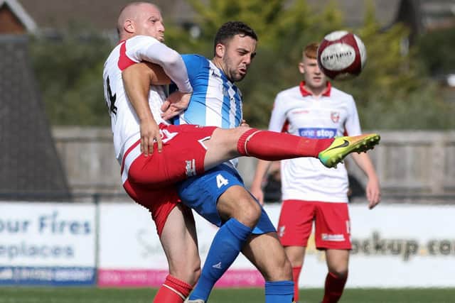 Neal Bishop wrestles with an Eccleshill opponent