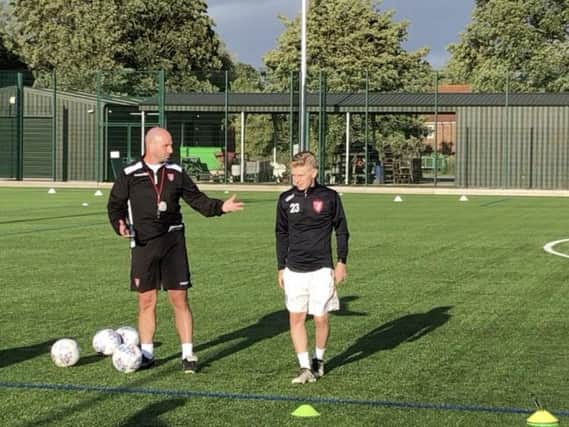 Dylan Cogill with boss Darren Kelly at a Boro training session