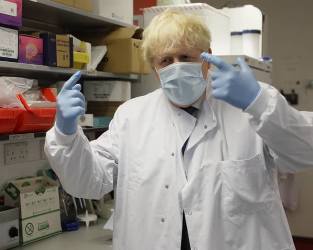 Prime Minister Boris Johnson gestures during a visit to the Jenner Institute in Oxford, where toured the laboratory and met scientists who are leading the COVID vaccine research. Photo: PA