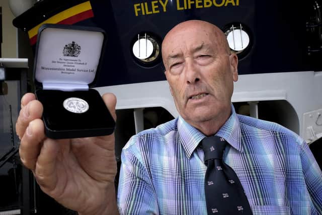 Chris with his medal.