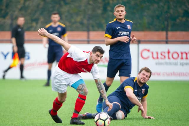 Angel Athletic (blue kit) play Eastfield United while Trafalgar (red kit) have to wait a further week to get back into action