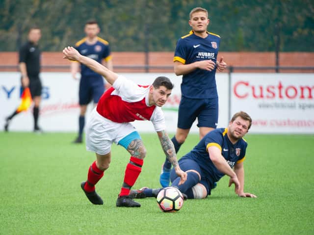 Angel Athletic (blue kit) play Eastfield United while Trafalgar (red kit) have to wait a further week to get back into action