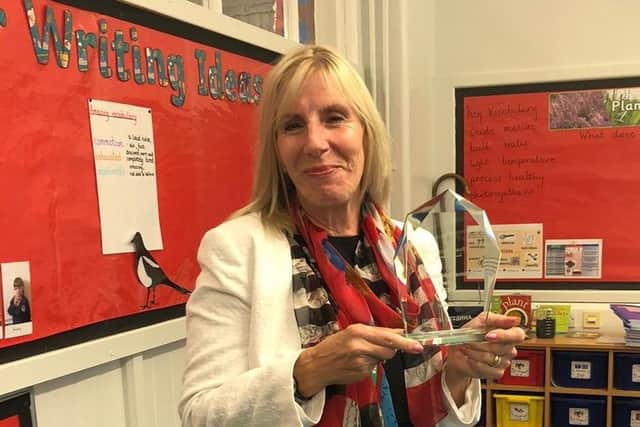 Annette Milner with the Lifetime Achievement in a Primary School award.