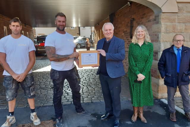 Danny Jepson of J3PSO receives his certificate from the Civic Society.