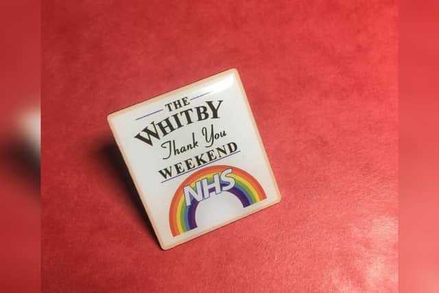 One of the enamel badges being given to participants