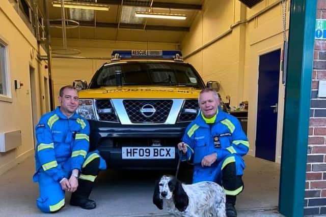 Two of the Staithes Coastguard team with Maisie, the dog they helped rescue after she fell from a cliff.