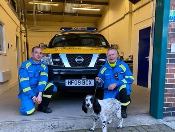 Two of the Staithes Coastguard team with Maisie, the dog they helped rescue after she fell from a cliff.