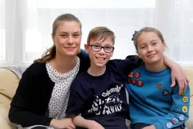 Issac Brown at home in Scarborough, pictured with mum Lauren Wilson and sister Lilly Brown.