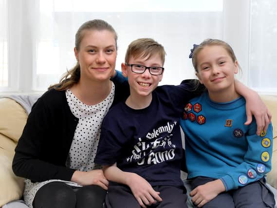 Issac Brown at home in Scarborough, pictured with mum Lauren Wilson and sister Lilly Brown.