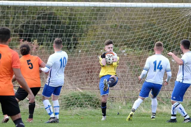 Newlands keeper Tom Cammish claims the ball in the win against Edgehill

PHOTOS BY RICHARD PONTER