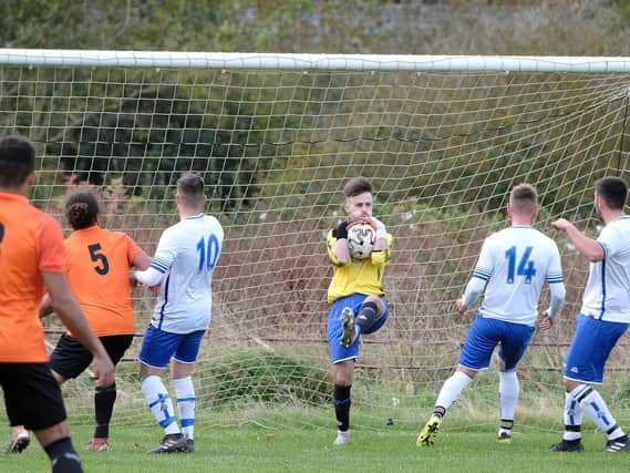 Newlands keeper Tom Cammish claims the ball in the win against Edgehill

PHOTOS BY RICHARD PONTER