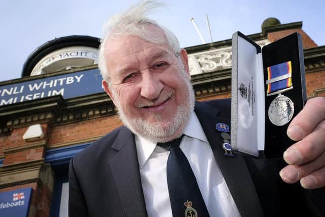 Pete shows off his medal - Pic: Richard Ponter