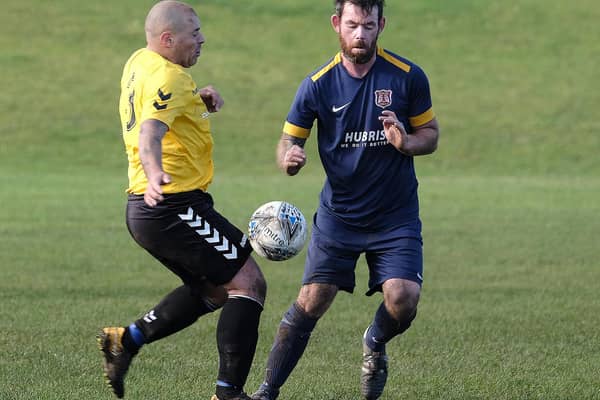 Angel Athletic and Connexsys battle for the ball in the North Riding County FA Sunday Cup. PICTURES BY RICHARD PONTER