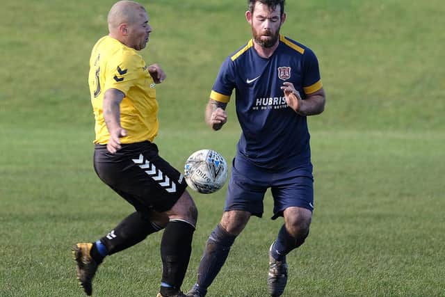 Angel Athletic and Connexsys battle for the ball in the North Riding County FA Sunday Cup. PICTURES BY RICHARD PONTER