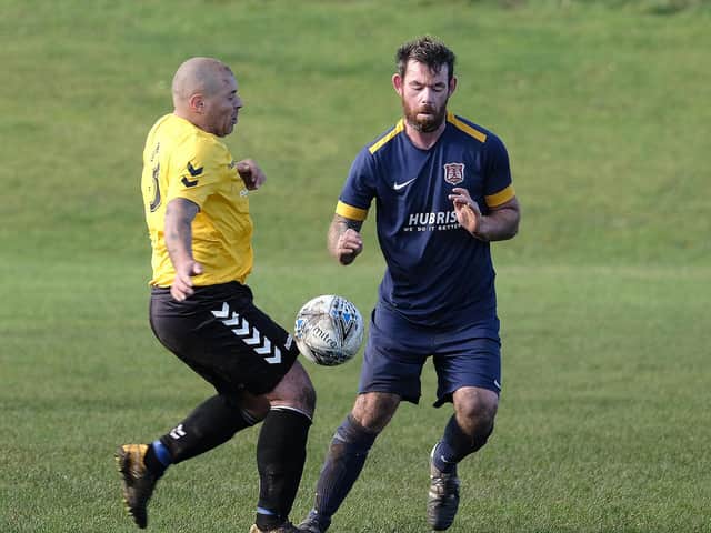 Angel Athletic and Connexsys battle for the ball in the North Riding County FA Sunday Cup. PICTURES BY RICHARD PONTER