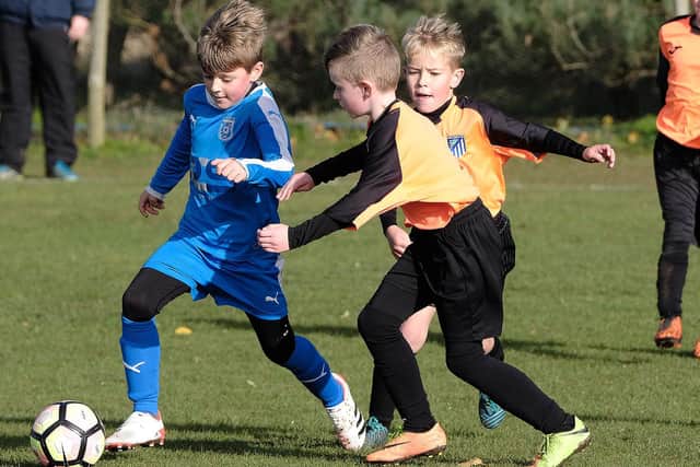 Heslerton Under-Nines’ captain lets fly with an effort during their game against Filey Holt. PICTURES: RICHARD PONTER