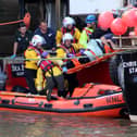 Grant Walkington and other members of the rescue crews at work helping those in trouble at sea.