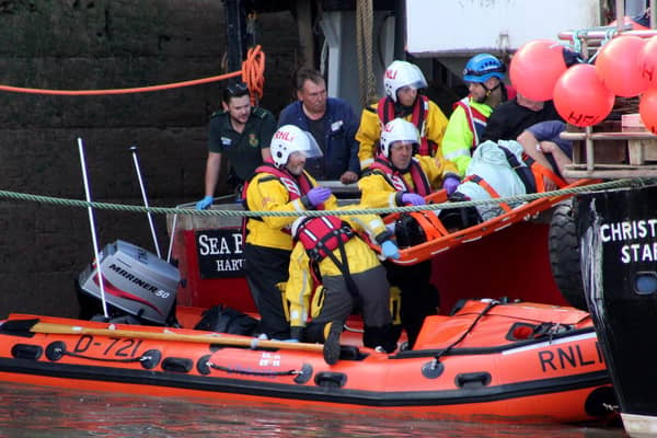 Grant Walkington and other members of the rescue crews at work helping those in trouble at sea.