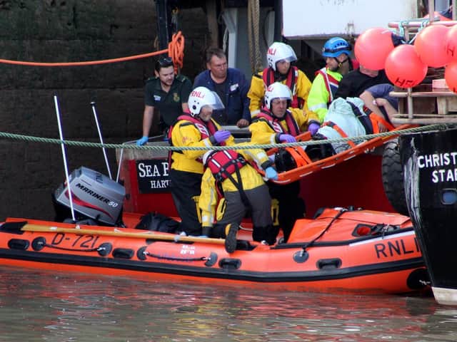 Grant Walkington and other members of the rescue crews at work helping those in trouble at sea.
