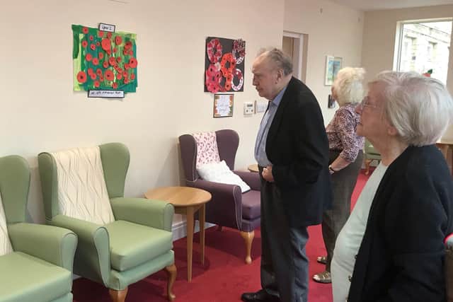 Residents at The Hall care home in Thornton-le-Dale enjoy the poppy artwork created by the village’s primary school pupils.