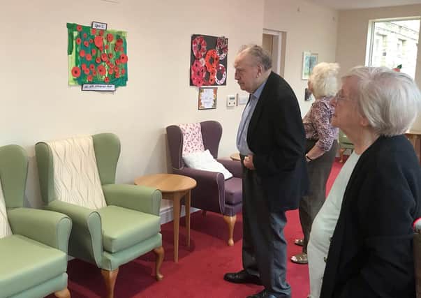 Residents at The Hall care home in Thornton-le-Dale enjoy the poppy artwork created by the village’s primary school pupils.