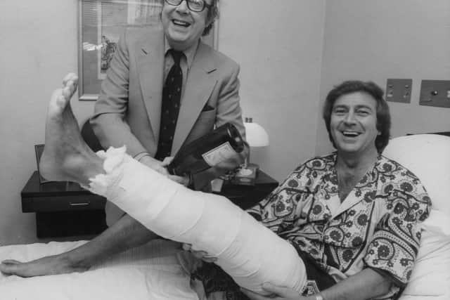 Des gets a visit from Eric Morecambe after breaking his leg in 1978.