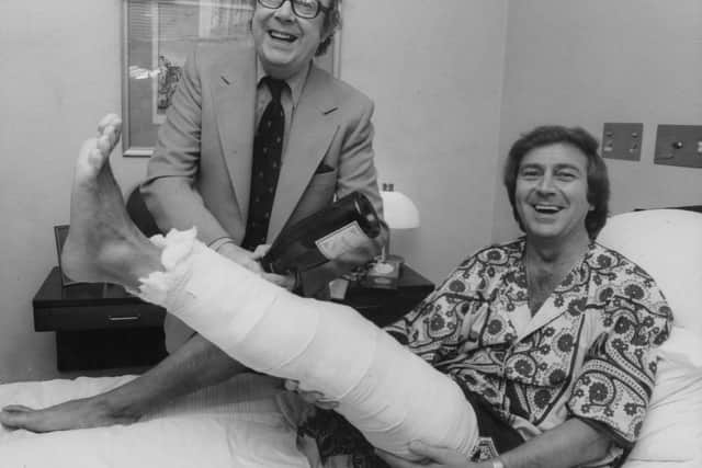 Des gets a visit from Eric Morecambe after breaking his leg in 1978.