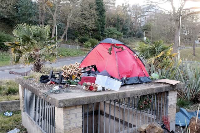 The tent was surrounded by Christmas decorations and other objects.