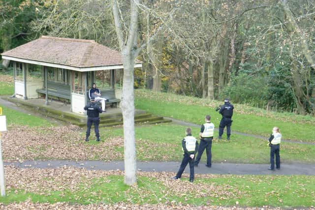 Armed police surround the man on Peasholm Drive