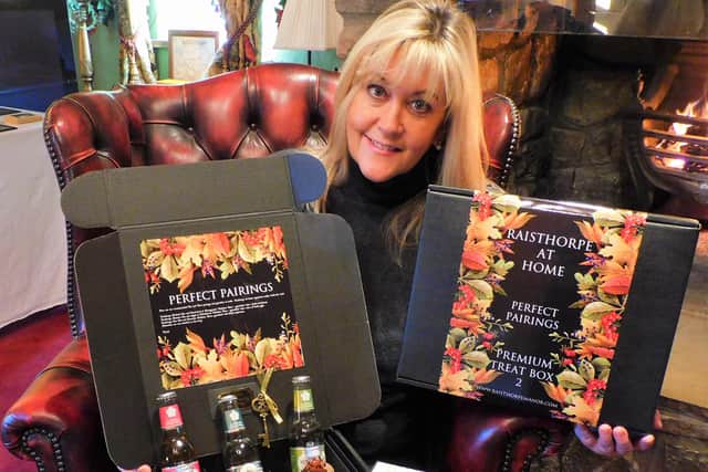 Julia Medforth, MD of Raisthorpe Distillery, is pictured with the treat boxes.