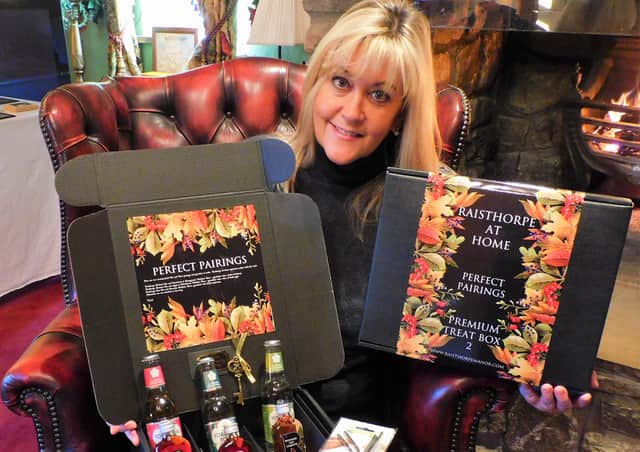 Julia Medforth, MD of Raisthorpe Distillery, is pictured with the treat boxes.