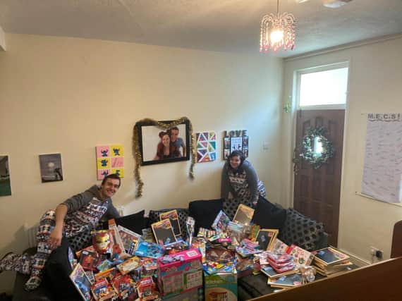 Joe and Courtney show off the toys they have collected