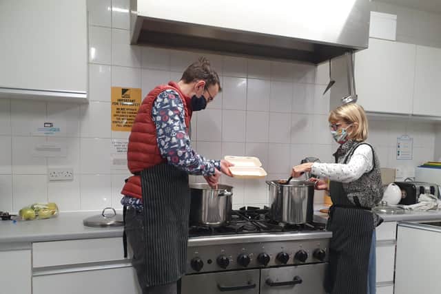 Rev Richard Townend and Rev Barbara Bancroft of Emmanuel Church in Bridlington preparing hot meals.
