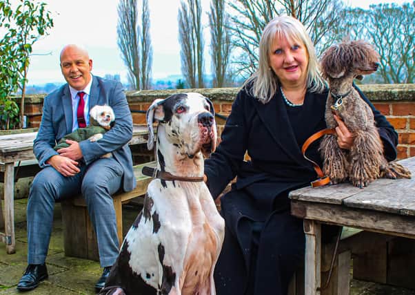 Canine Concierge Angela Egan is pictured with Talbot Hotel general manager Steve Brown and their pets Anya, Nora and Darcy. Photo taken by Merry Councell