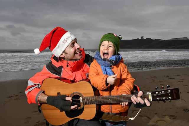 Luke sings a festive song on North Bay with a little help from his son Callum.