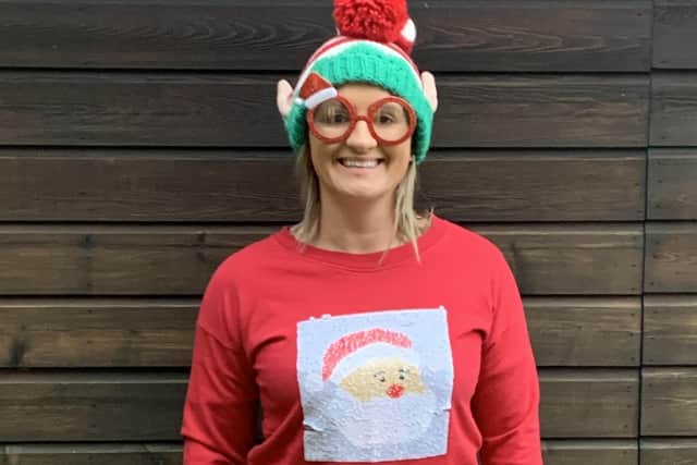 Louise Booth, at Lloyd Dowson, shows off her Christmas Jumper.