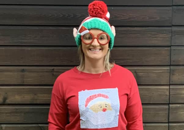 Louise Booth, at Lloyd Dowson, shows off her Christmas Jumper.