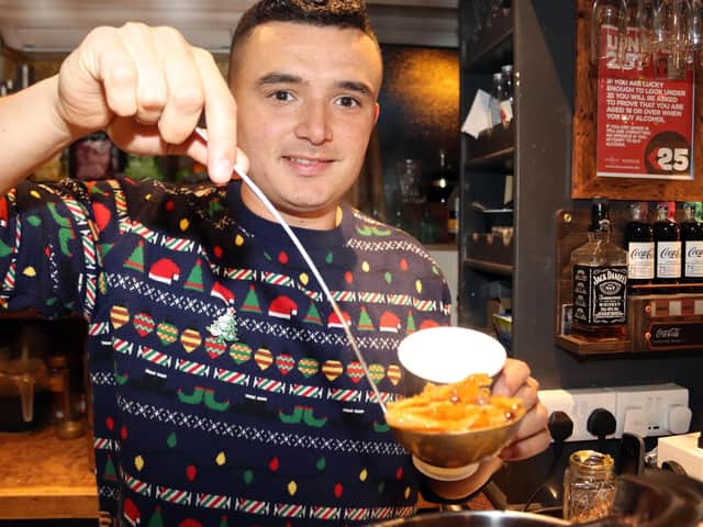 Hideout Manager Jordan Padgham serves up the home-made soup at last year's event.