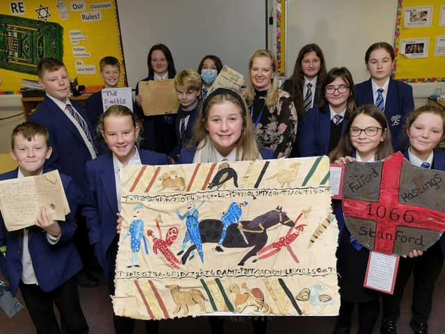 Filey Ebor school students celebrate their history project with History teacher Ms Williams.