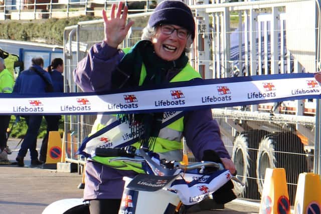 Stephanie crossing the finish line.