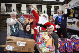 Courtney Richardsonand Joe Maw deliver gifts to the Rainbow Centre,pictured with Trish Kinsella of the Rainbow Centre assisted by Santa and Lions
President Rob Hunter