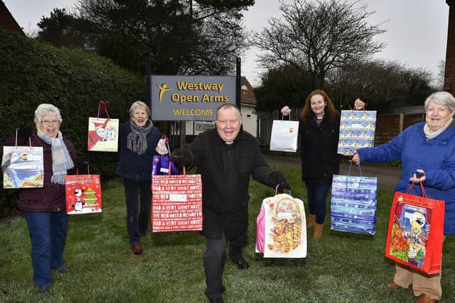 East Ayton church have collected gifts for Eastfield children to hand in at Westway Open Arms. (L-R): Christine Derrington, Angela Adams, Rev Andrew Moreland, Rev Sam Taylor, and Yvonne Quinsey. pic Richard Ponter