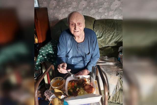 Eric enjoys his Christmas dinner