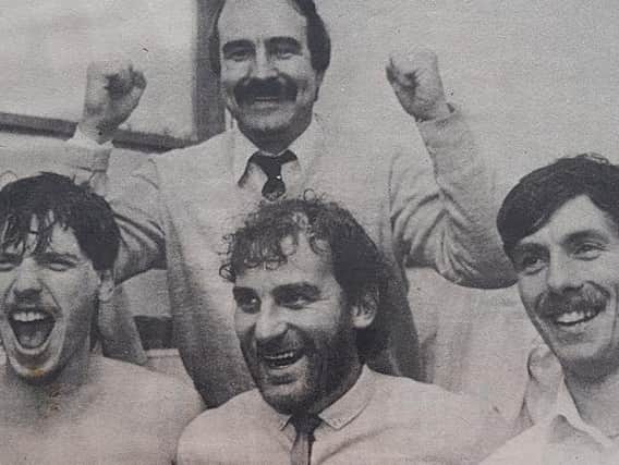 Tony Lee celebrating the win over Halifax Town with the Whitby players.