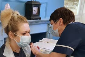 Stephanie Harbron, Team Leader at Saint Cecilia’s Care Home, receives her vaccination.