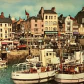 This postcard shows a busy harbour scene from the 1960s. Image submitted