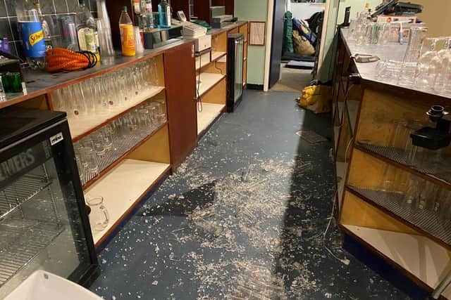 Vandals smash glass inside clubhouse.